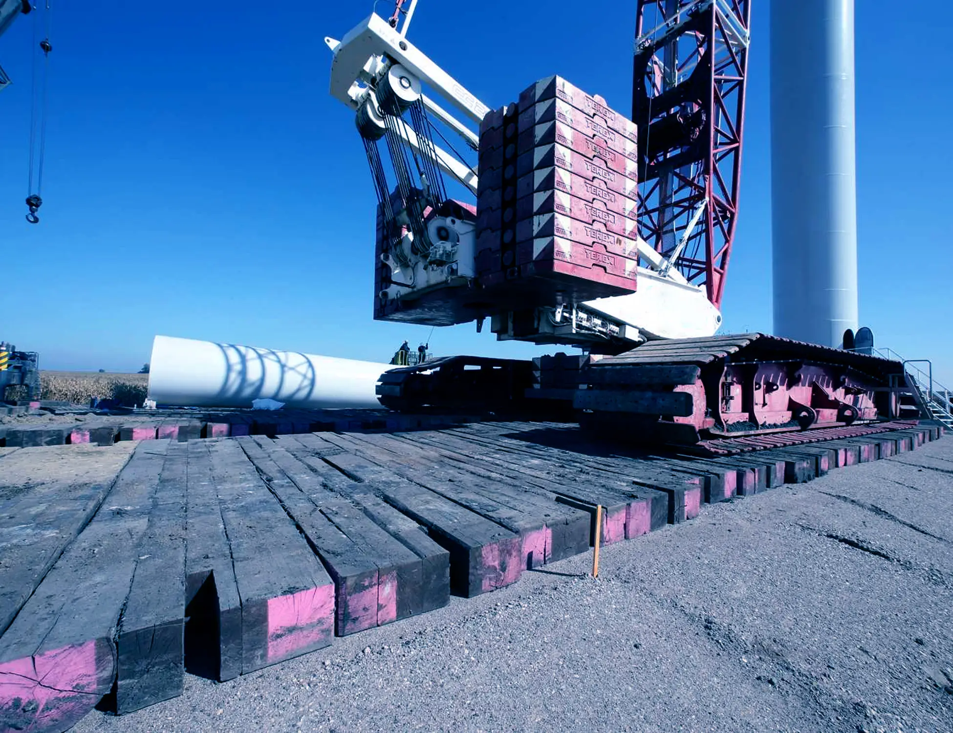 Several crane mats and a crane on jobsite